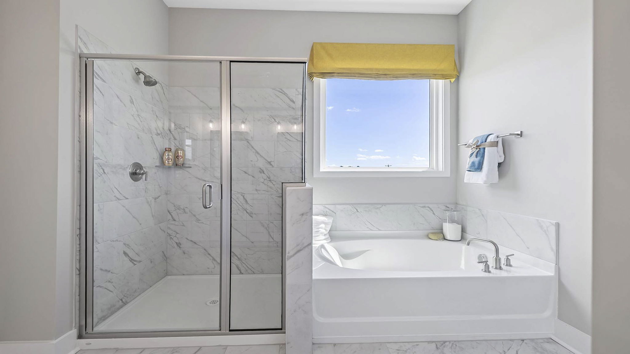 Primary bathroom with double vanity sinks.