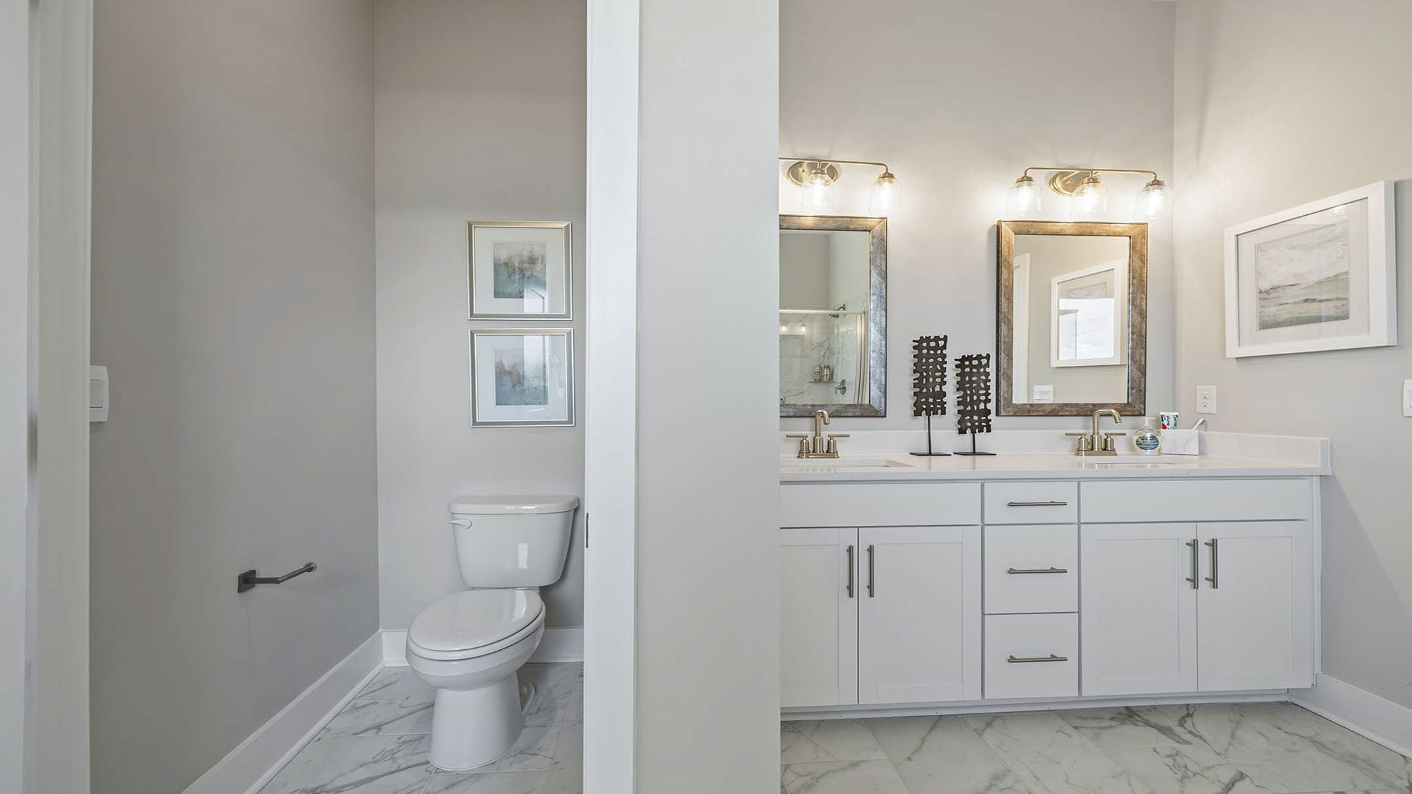 Primary bathroom with double vanity sinks.