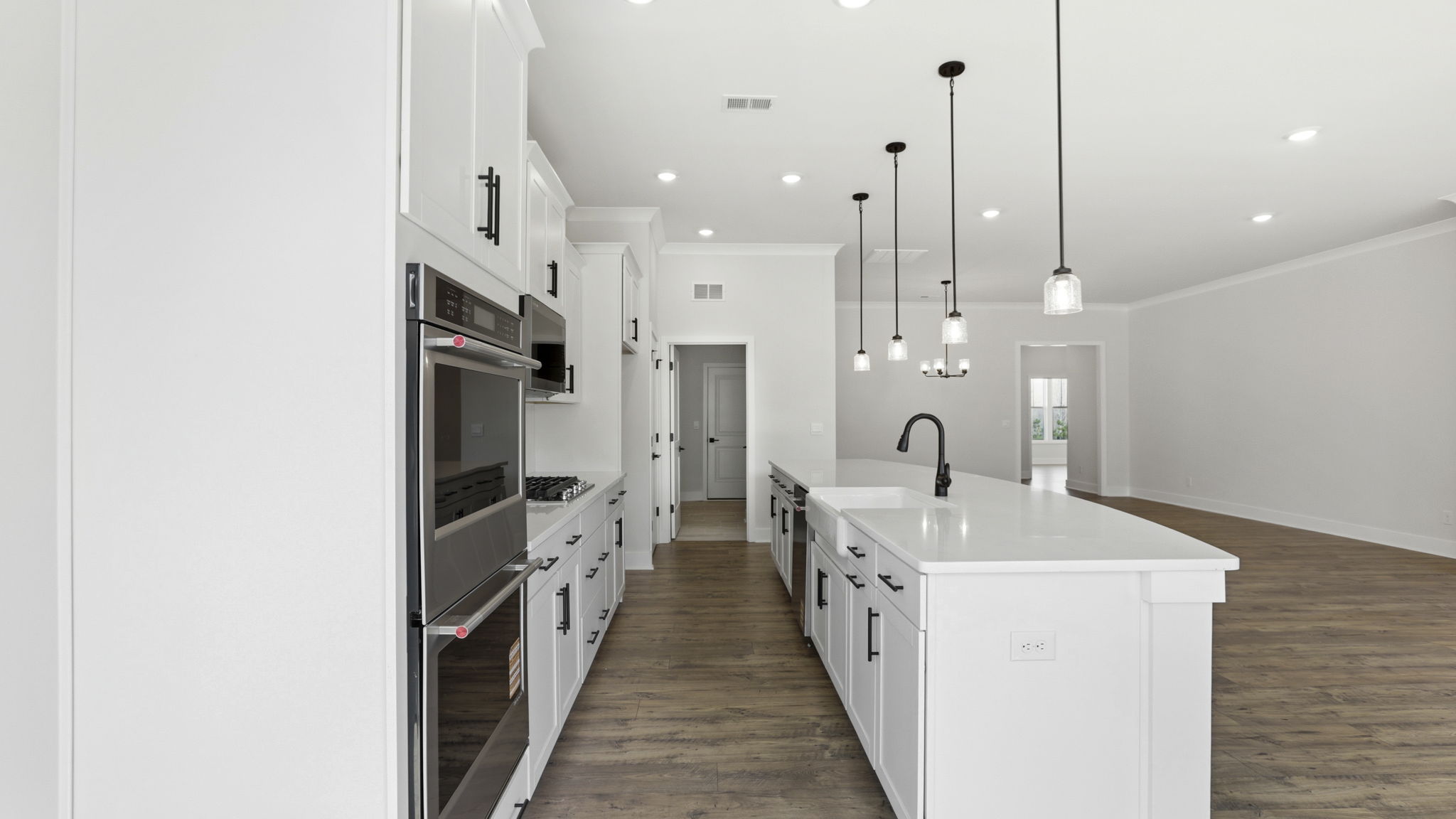 View of kitchen and the double wall ovens.