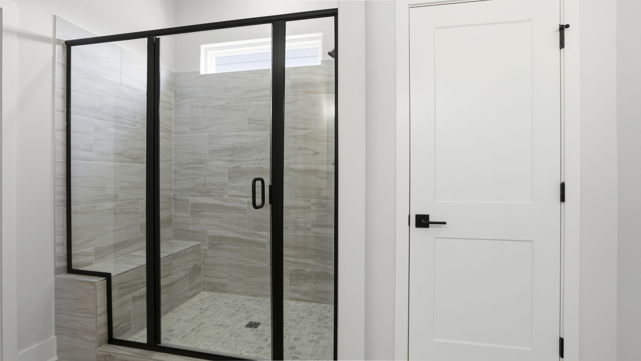 Primary bathroom with walk-in shower.