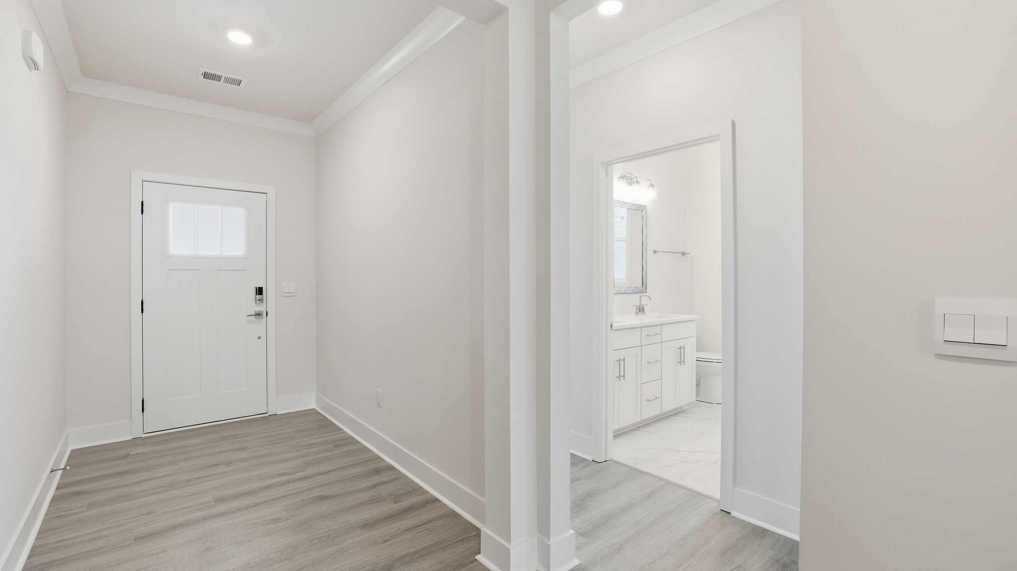 View of foyer and front bedroom entrance.