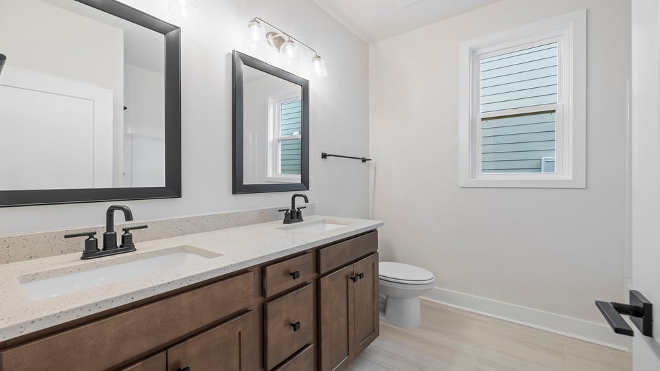Bathroom with double vanity sinks.