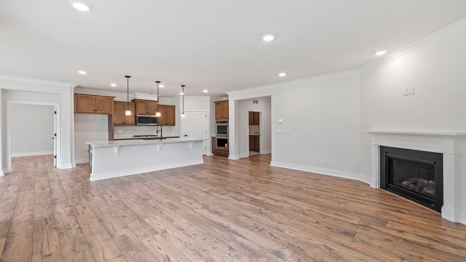 Living area with fireplace and windows.