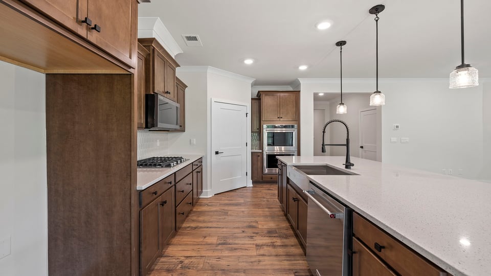 Kitchen with island and cabinets.