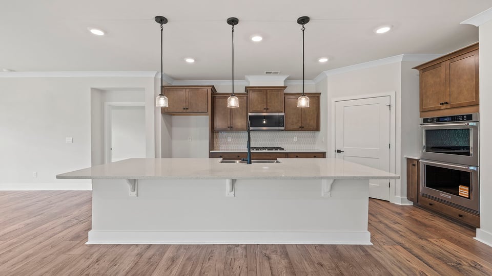 Kitchen with island and cabinets.