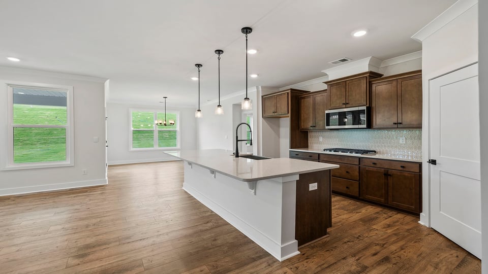 Kitchen with island and cabinets.