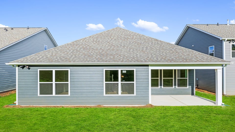 Back exterior with large backyard.