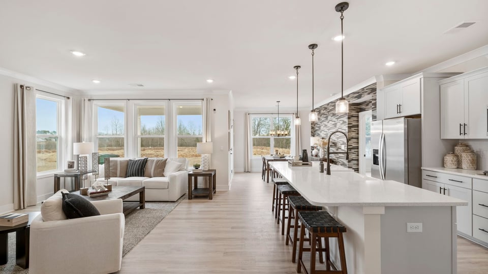 Living area with fireplace and windows.