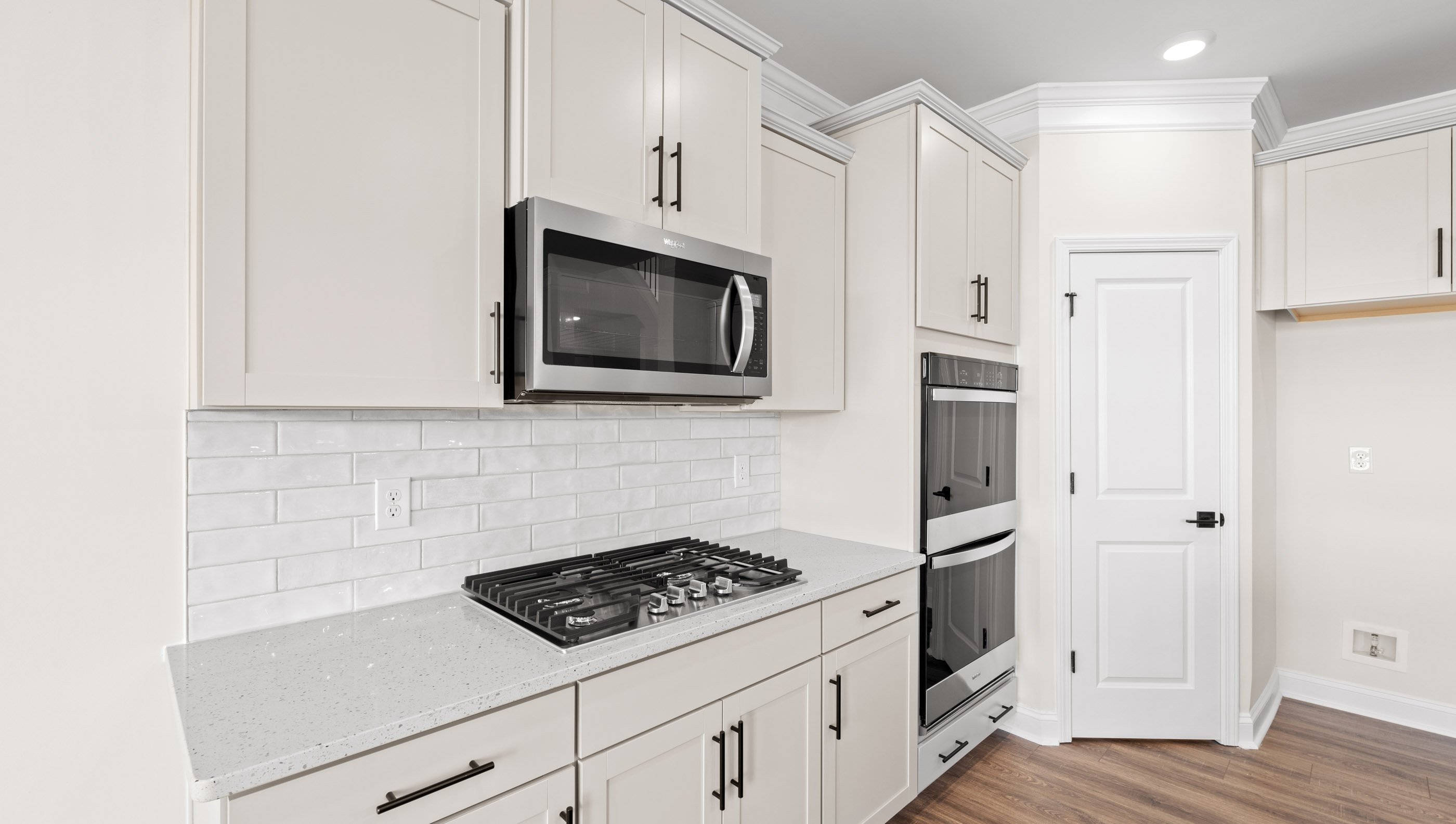 Kitchen with island and cabinets.