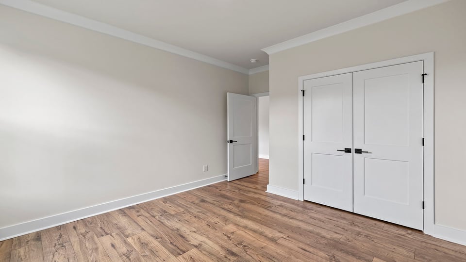 Bedroom with window and closet.