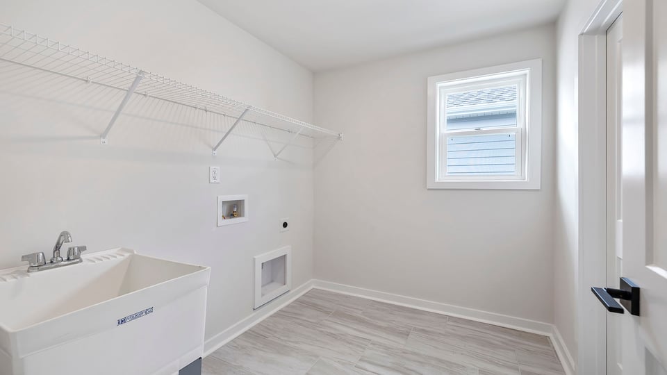 Laundry room with window.