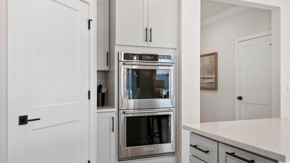 Kitchen with island and cabinets.