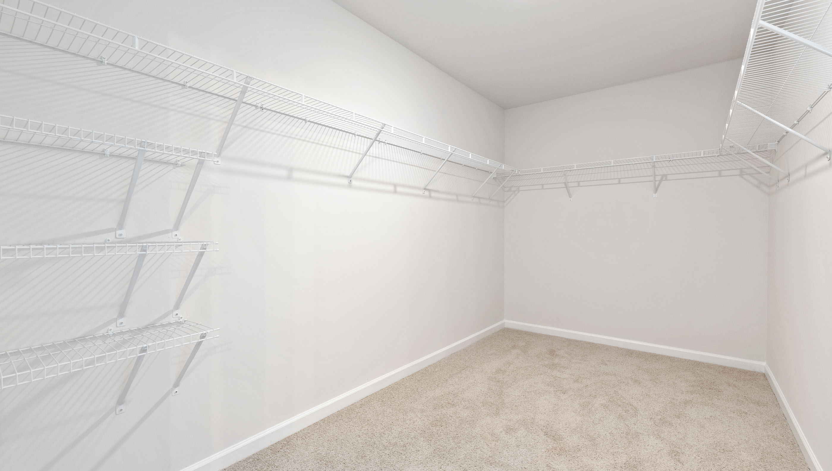 Primary bedroom walk-in closet.