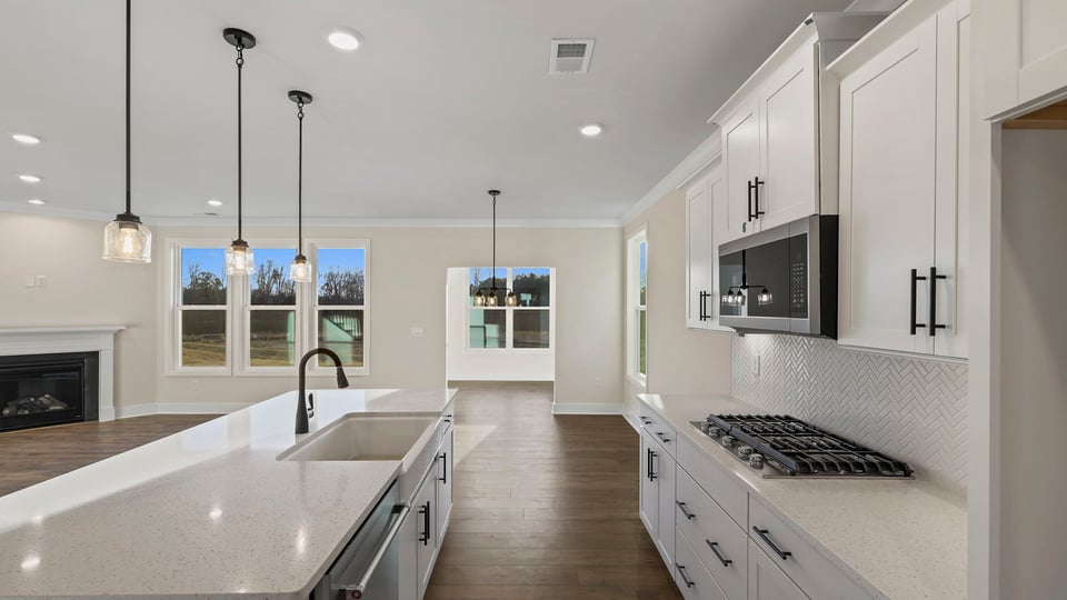 Kitchen with island and cabinets.