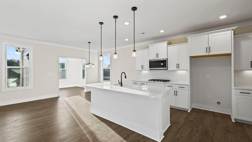 Kitchen with island and cabinets.