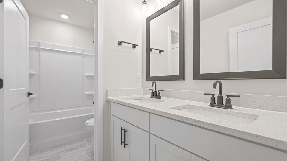 Bathroom with double vanity sinks.