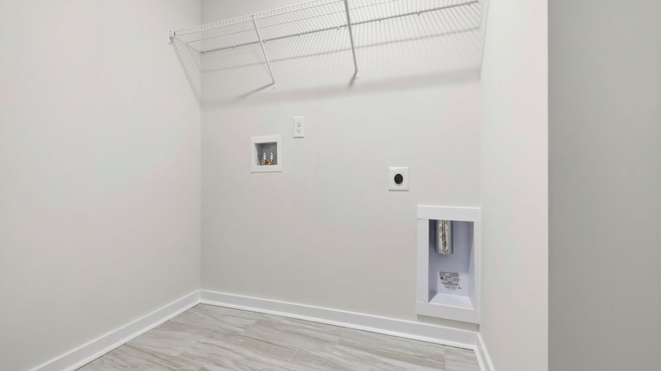 Laundry room with shelf.