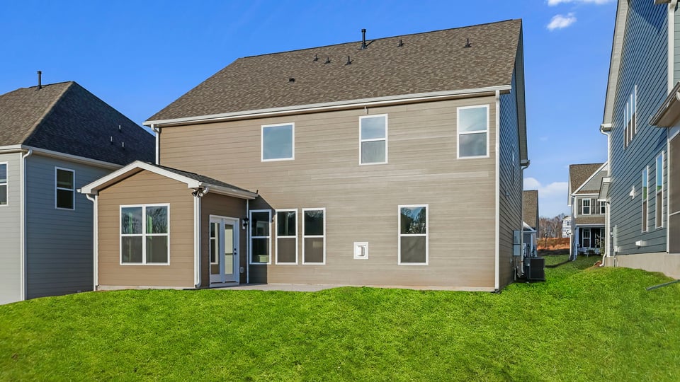 Back exterior with large backyard.