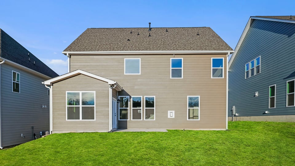 Back exterior with large backyard.