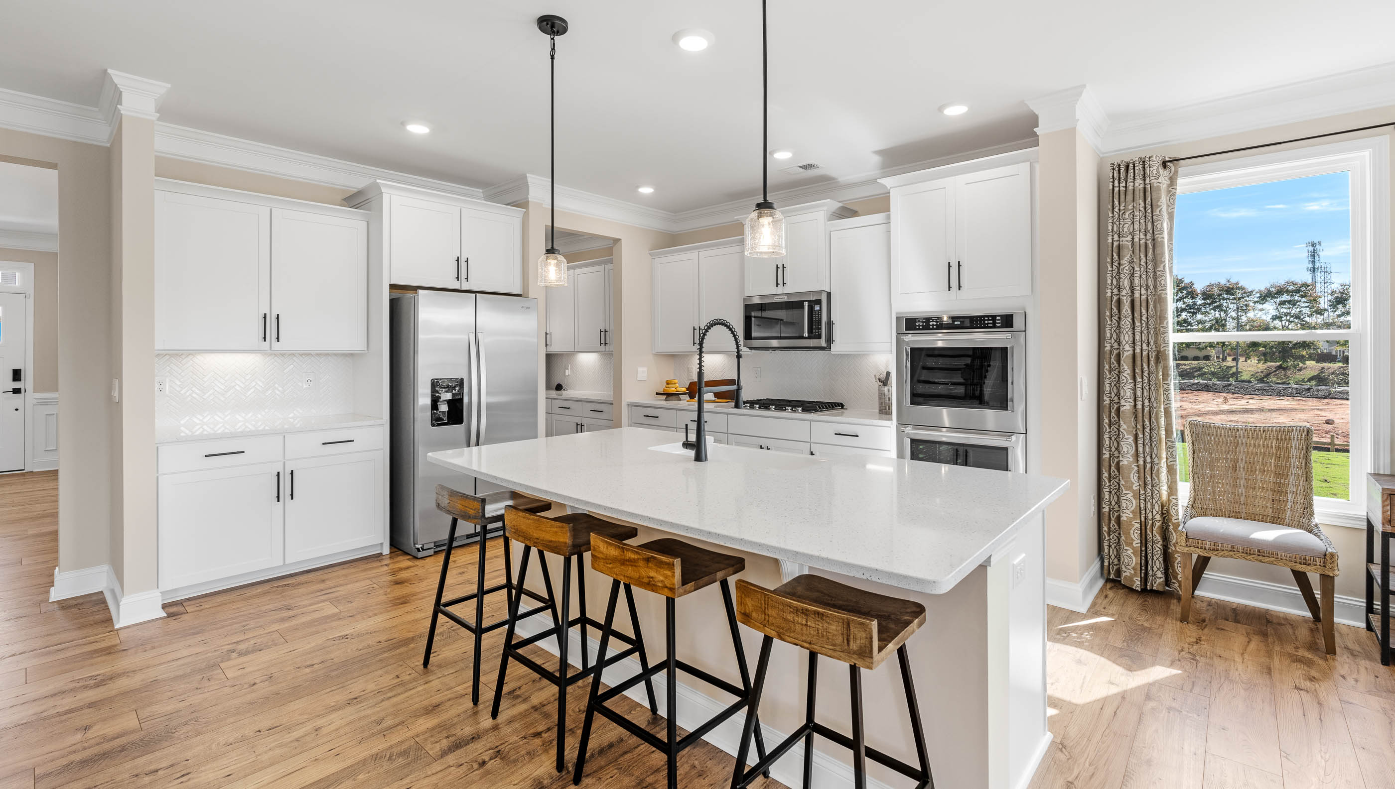 Kitchen with island and cabinets.