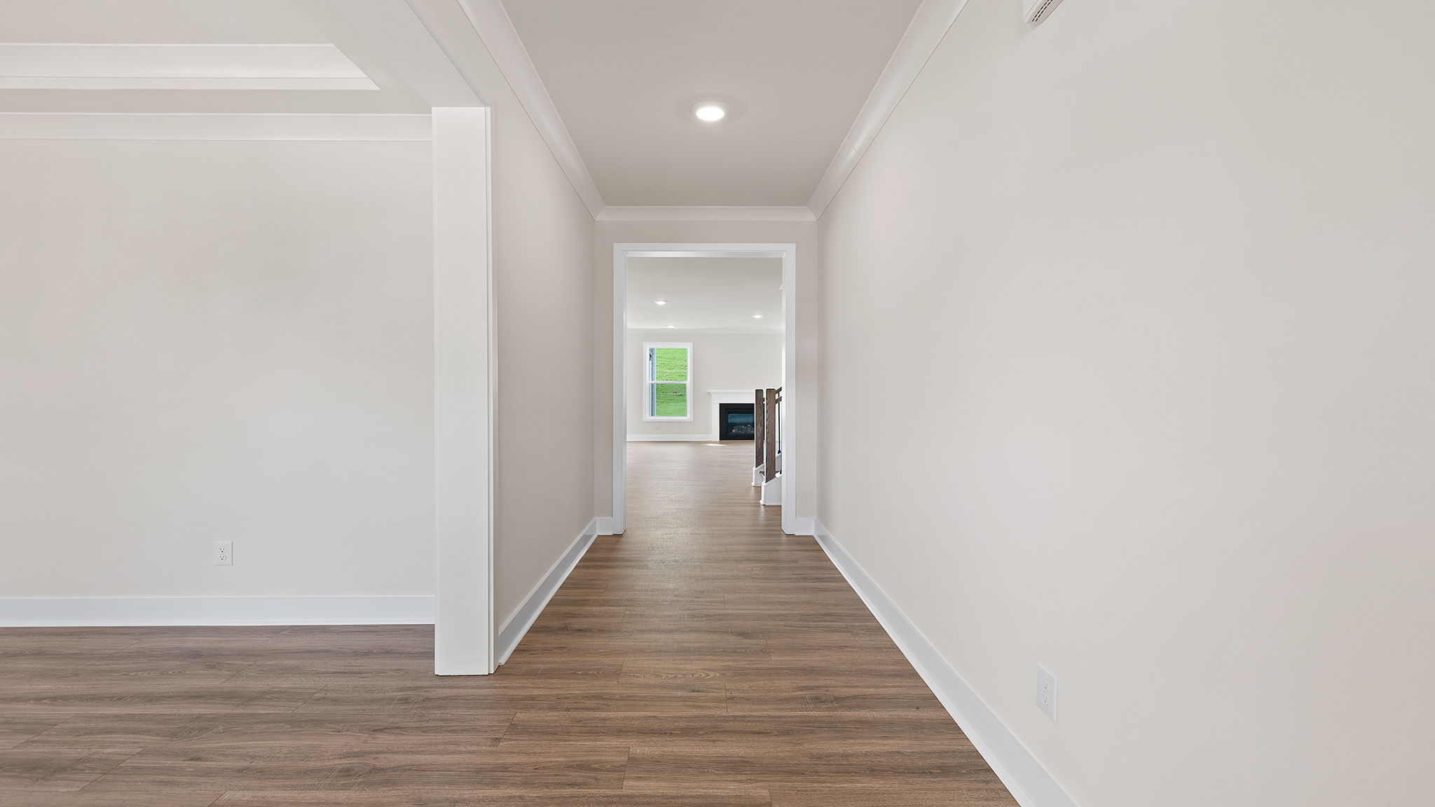View of large hallway toward the living area and dining room.