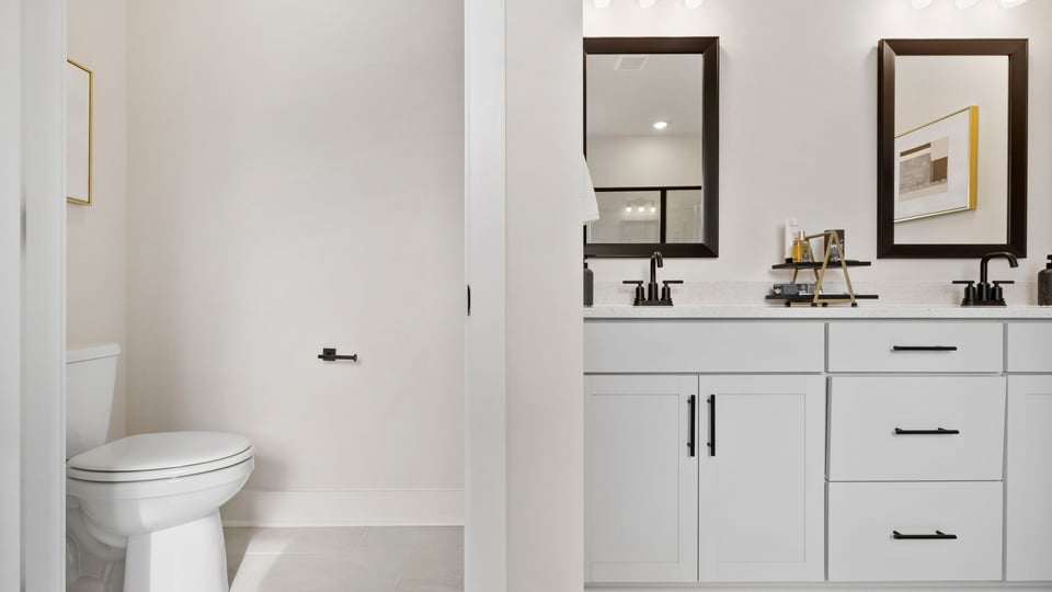 Primary bathroom with double vanity sinks.