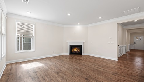 Family room with fireplace and window.