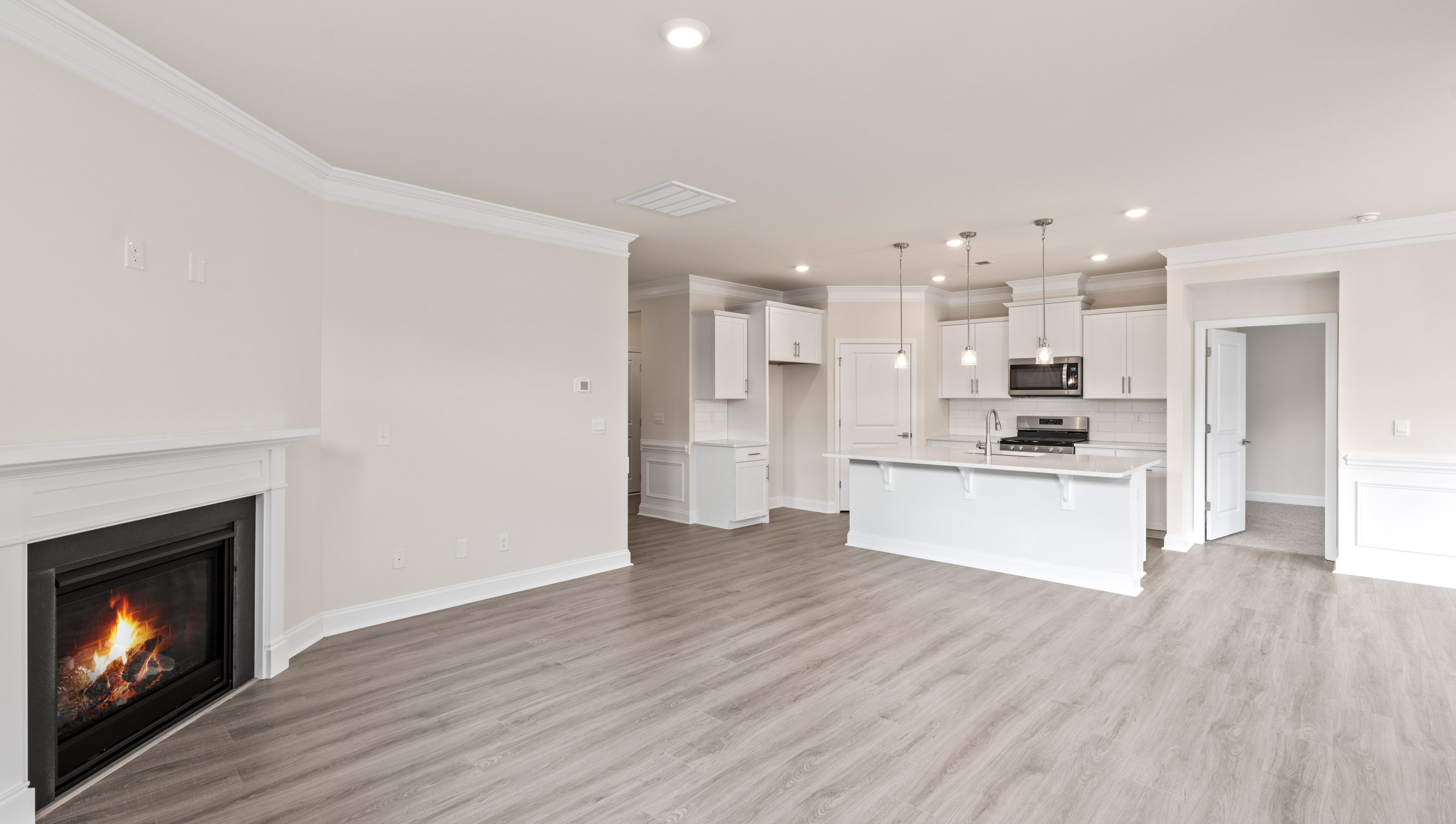 Living area with fireplace and windows.