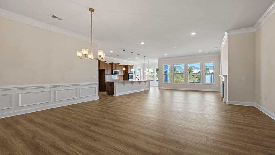View of the open floor plan with wall of windows.