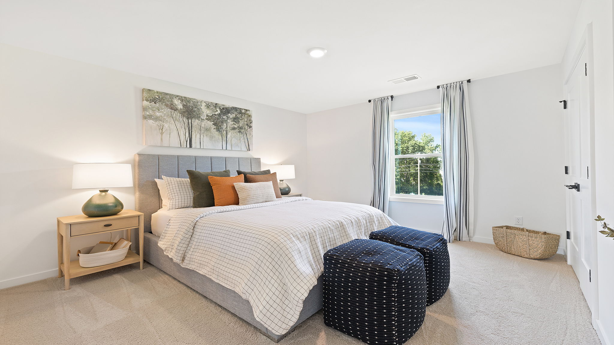 Bedroom with carpet and windows.