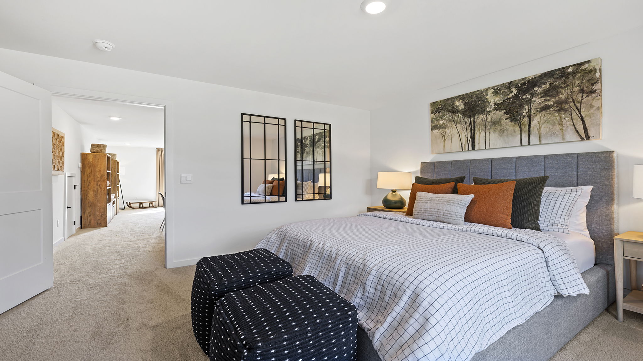 Bedroom with carpet and windows.