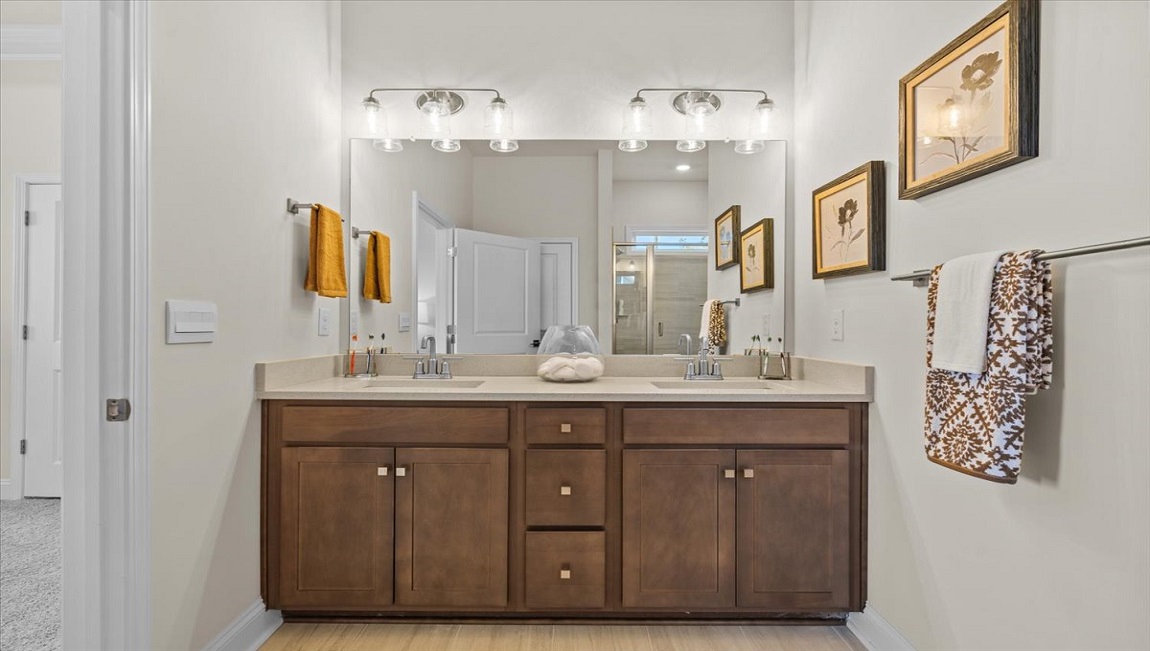 Primary bathroom with double vanity sinks.