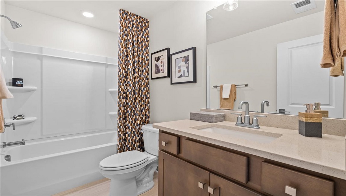 Bathroom with vanity sink and shower.
