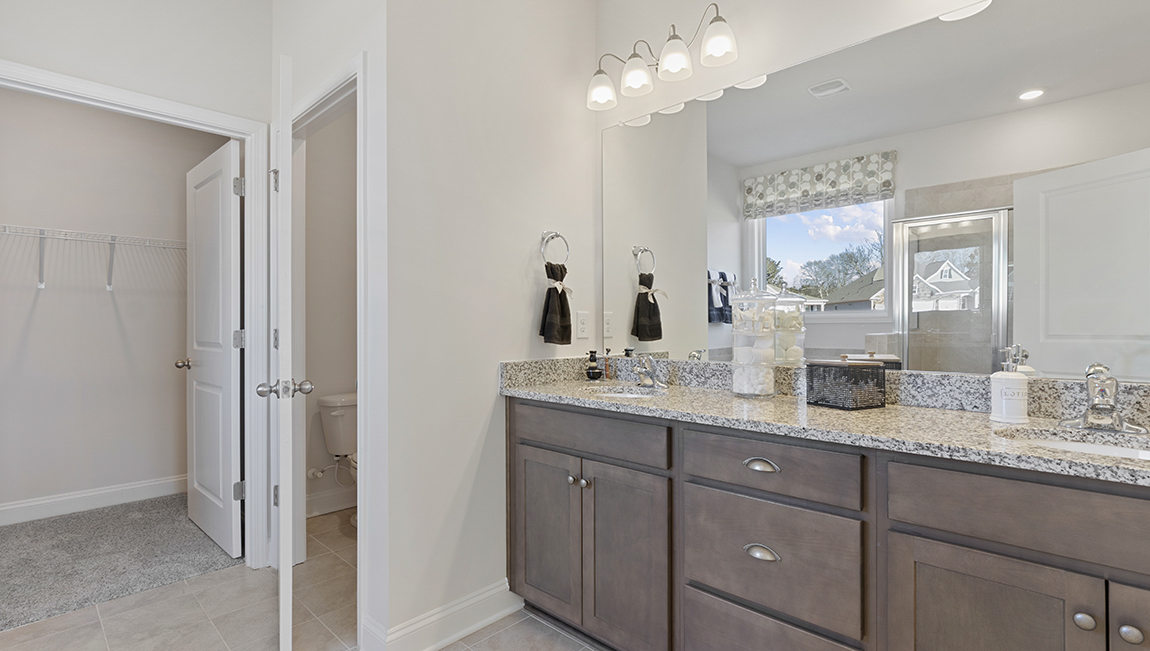Primary bathroom with double vanity sinks.