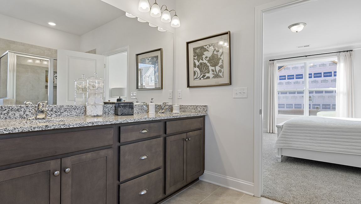 Primary bathroom with double vanity sinks.