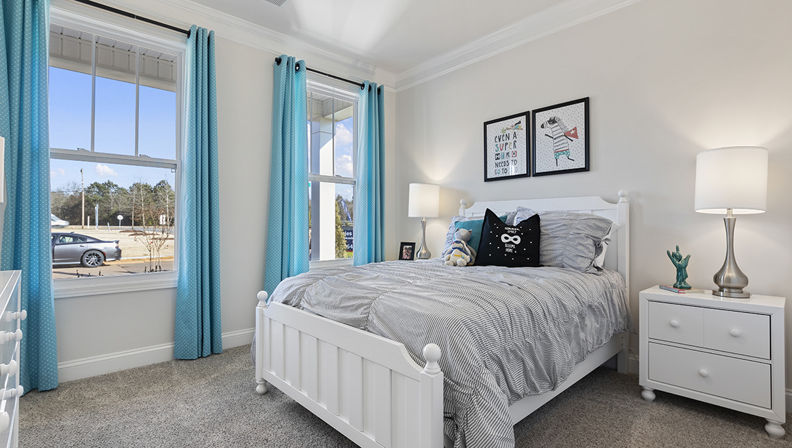Bedroom with carpet and window.