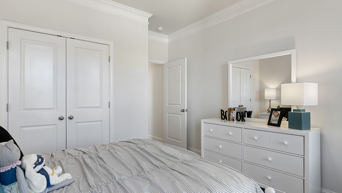 Bedroom with carpet and window.
