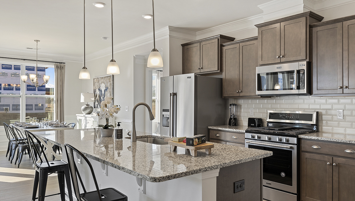Kitchen with island and cabinets.