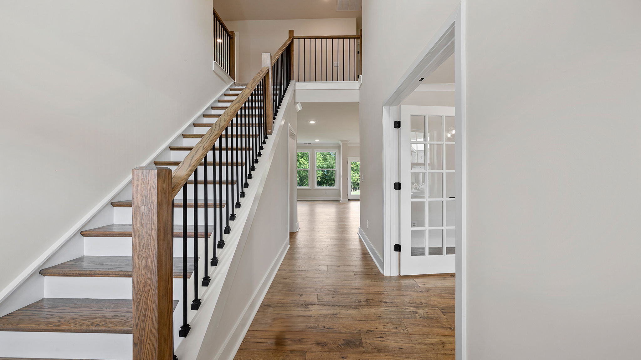 View of stairwell and hallway to the family room.