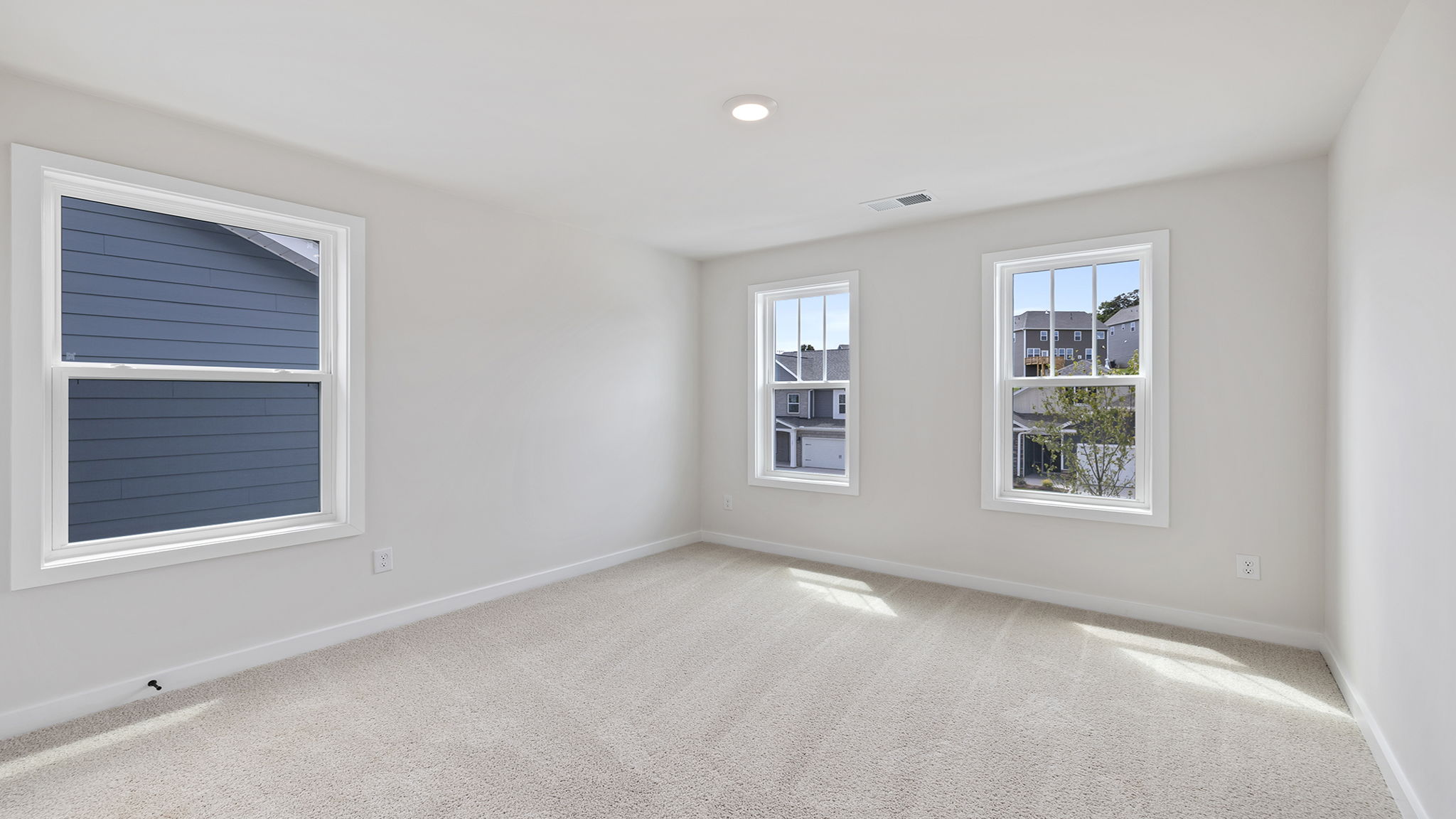 Bedroom with window and carpet