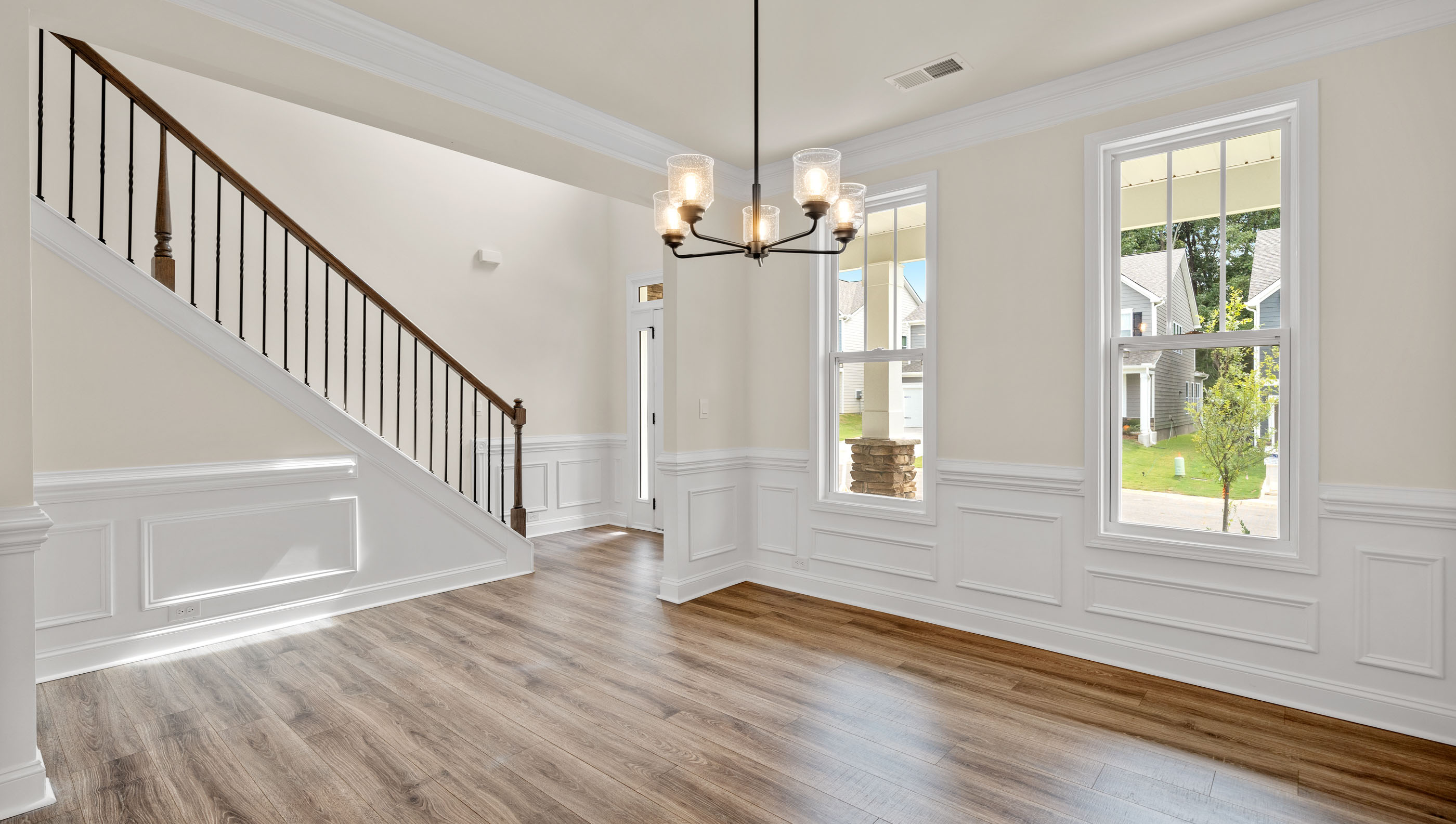 Formal dining space with windows.