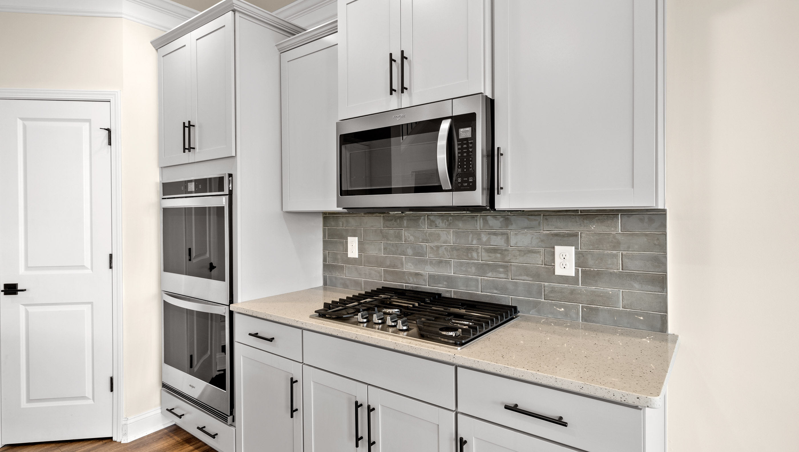 Kitchen with island and cabinets.