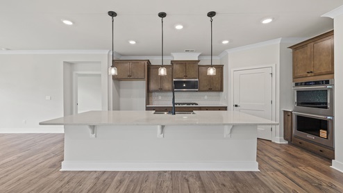 Kitchen with island and cabinets.