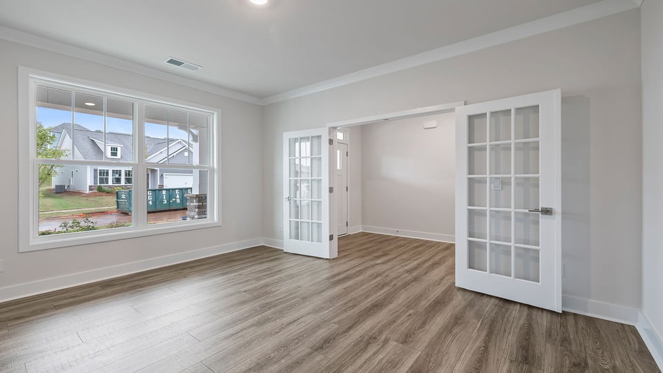 Study accented by French doors.