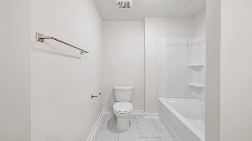 Hall bathroom with combination shower / tub.