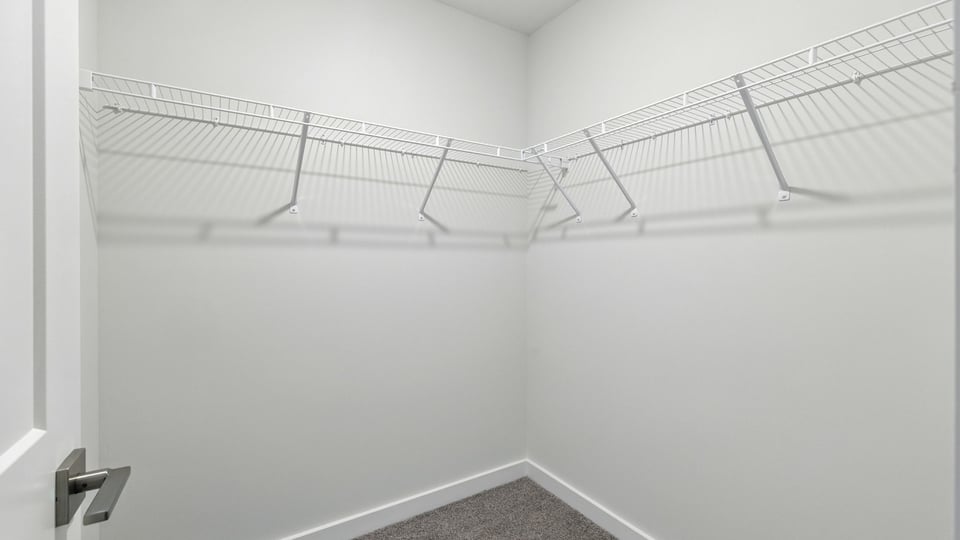 Primary bedroom walk-in closet.