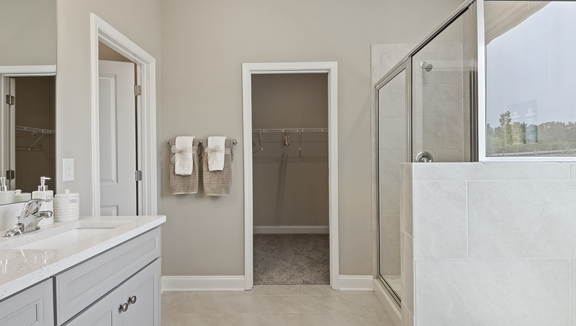 Primary bathroom with double vanity sinks.
