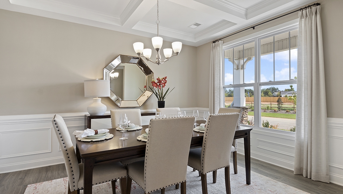 Formal dining room with window.