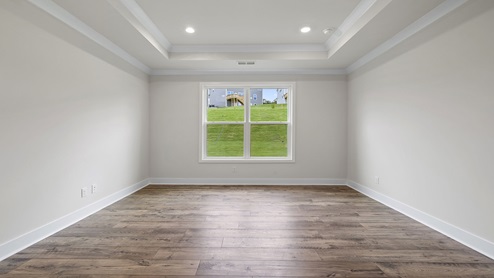Primary bedroom with window.