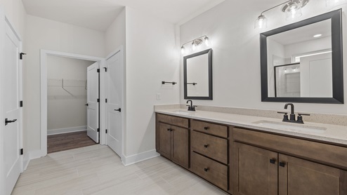 Primary bathroom with double vanity sinks.